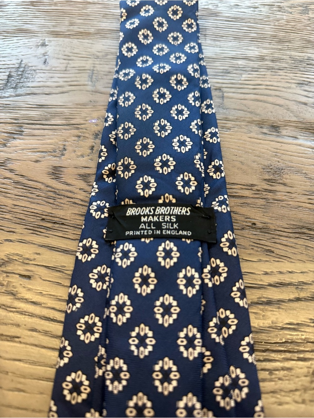 Brooks Brothers Navy Blue Silk Tie with Cream Medallion Pattern